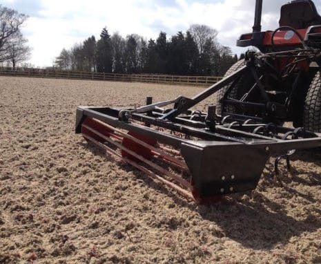 Tractor pulling riding area surface conditioner equipment